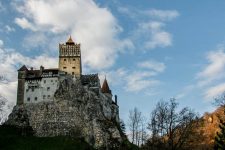 A menacing castle on top of a rocky hill in Romania