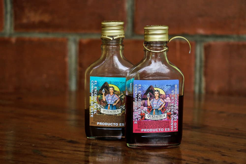 Two bottles of Guatemalan liquor with colourful labels.