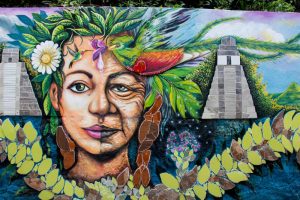 Graffiti featuring Mayan face and temple ruins in Guatemala