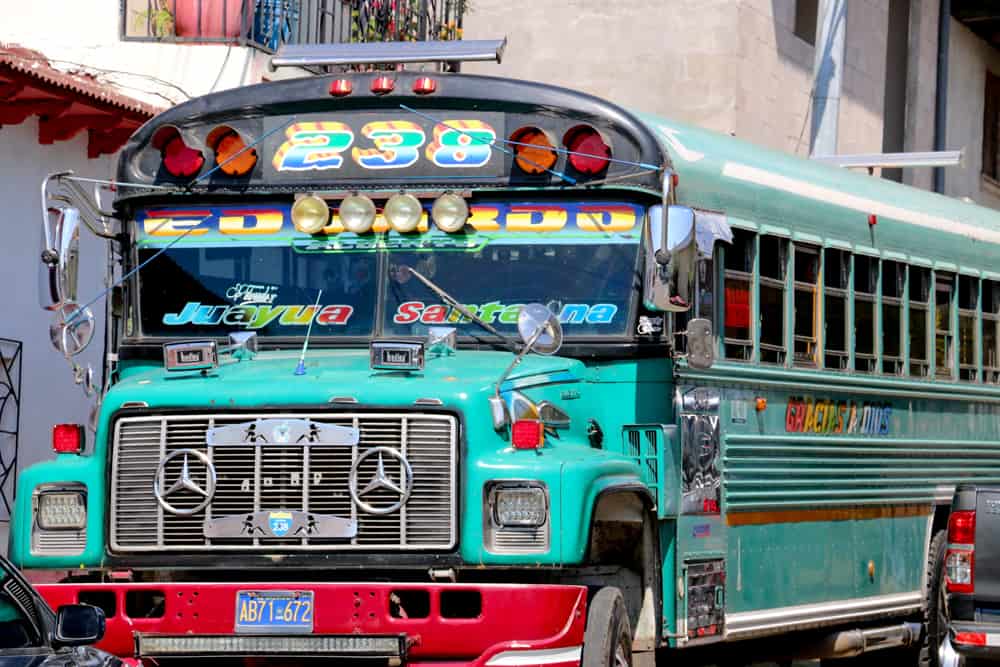 Blue school bus covered in chrome accents