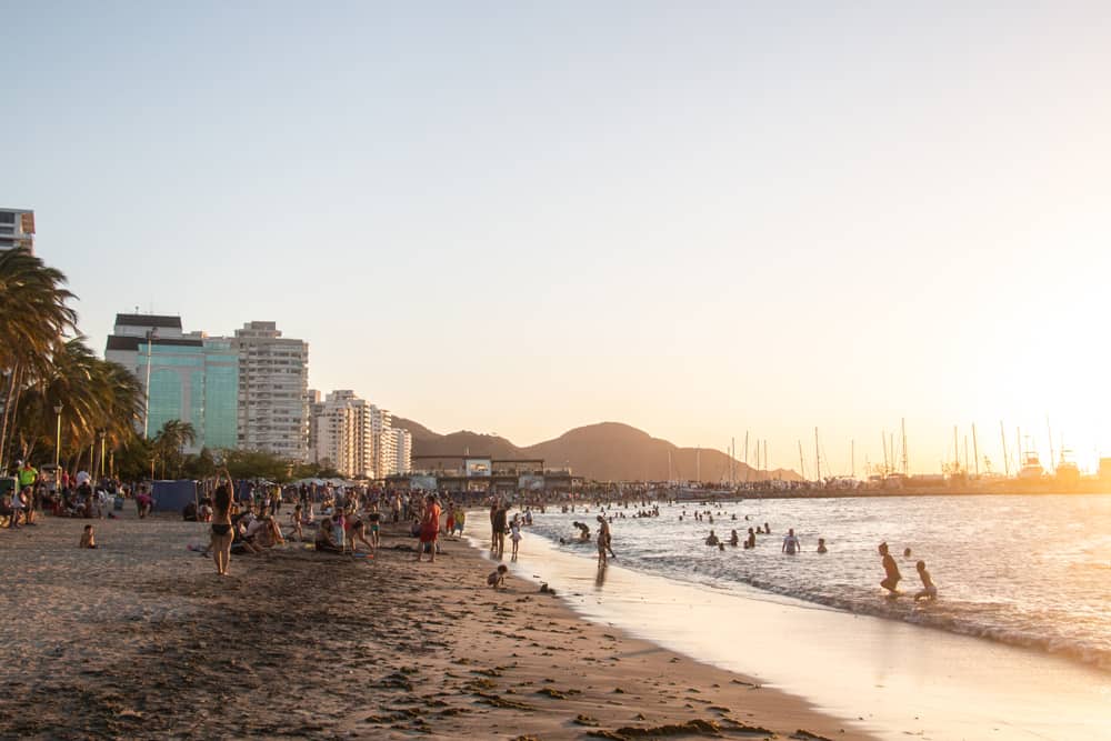 Sunset over a very crowded beach