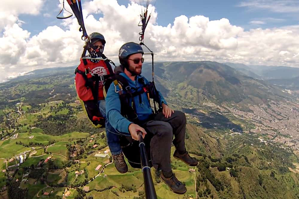 Two people in a harness high above the ground