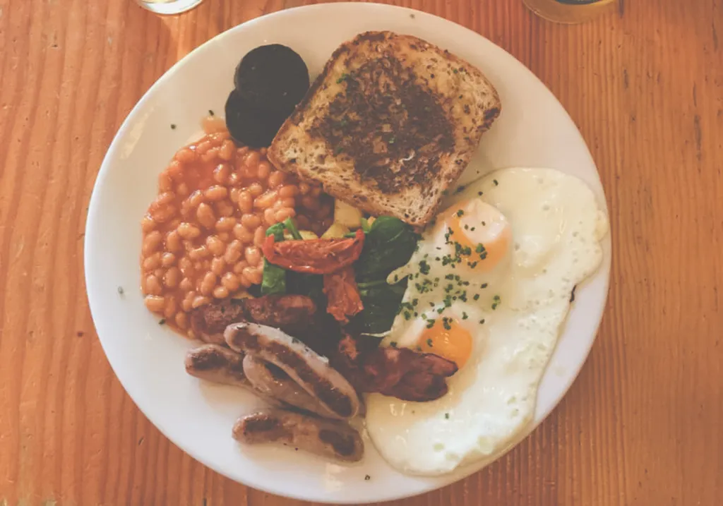 Plate with a full English breakfast from the famous Bristolian Cafe in Bristol.