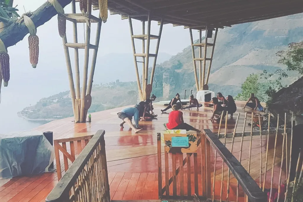 People doing yoga on a platform in San Marcos overlooking Lake Atitlan.