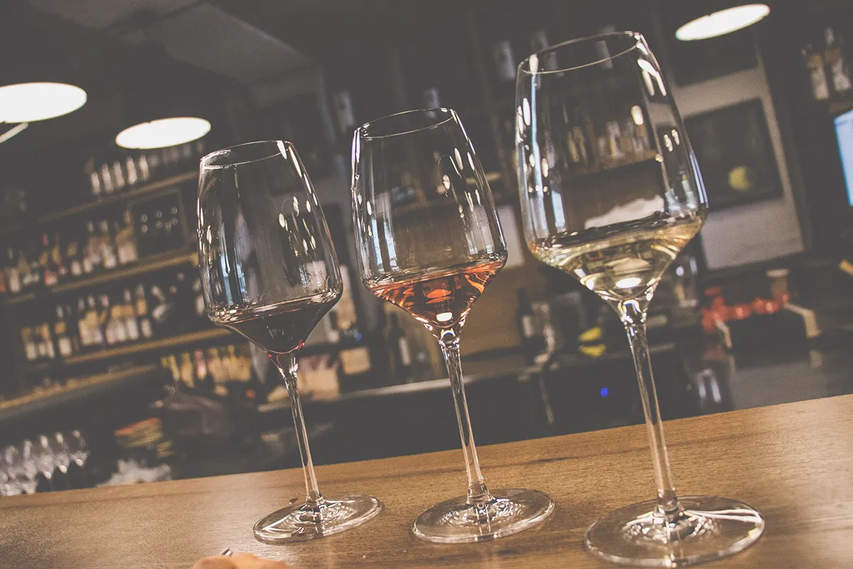 Three wine glasses on a bar in Chisinau Moldova.